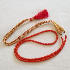 The product is made according to the model of authentic Indian jewelry. They make necklace even more refined and original. The coral is natural The ties are made of silk fabrics. They are pleasing to the body and make your look interesting even from behind. First come, first served! Type of metal: Coral Beads With (silk fabrics) Full length: 50.8cm/20inches ※including no clasp Necklace Weight: 16 Gm Beads size: Length - 9-4mm. Depth - 4-3.5mm. ※Size is approx. Type of coral: Natural Italian cora Traditional Adjustable Single Strand Beaded Necklaces, Traditional Adjustable Single Strand Beaded Necklace, Elegant Adjustable Red Coral Beaded Necklaces, Elegant Adjustable Red Coral Beaded Necklace, Traditional Coral Necklace With Gemstone Beads, Traditional Coral Single Strand Necklace, Traditional Adjustable Beaded Necklaces With Gemstone Beads, Adjustable Traditional Beaded Necklaces With Gemstone Beads, Red Round Beads Necklace For Ceremonial Occasions