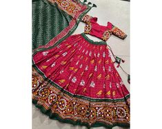 Red Chaniya Choli for Navratri Patola Lehenga 3 pc Readymade garba Lehenga Festival outfit Gamthi Work Garba Night lengha ready to wear 🌷Navratri Collection 2024🌷 Adorn yourself in the artistry of Tussar silk and the mesmerizing allure of ikkat Patola prints with this exquisite navratri lehenga choli ensemble Lehenga(Stitched) Lehenga Fabric : Tussar Silk  Lehenga Work : Patola Print With Gamthi Work Lace And Foil Work Lehenga Waist : SUPPORTED UP TO 42 Lehenga Closer : Drawstring With Heavy T Red Chaniya Choli, Garba Lehenga, Patola Lehenga, Chaniya Choli For Navratri, Choli For Navratri, Gamthi Work, Lehenga Stitched, Garba Night, Navratri Lehenga