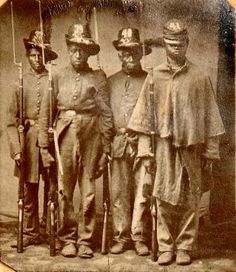 Four members of the 33rd United States Colored Troops stood for a portrait sometime in 1864 or 1865. The three soldiers on the left are wearing Hardee hats. Enoch Robbins transferred from the 8th Maine Infantry to the 33rd USCT and ultimately became a captain. Port Royal, By Any Means Necessary, February 8, American Soldiers, African History, Us History, Black American, African American History, Mellow Yellow