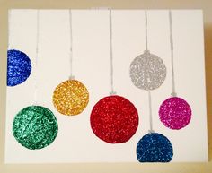 an art project with glitter balls hanging from strings