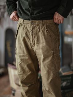 Offering timeless wardrobe staples. Steeped in timeless Americana and rugged style, these cargo pants are utilitarian inspired. Crafted from durable cotton canvas they feature multiple pockets for storing the essentials. For a rugged and well-worn appearance, a stone wash completes the design. FEATURES Regular fit with a standard rise. Belt loops. Side adjusters. Zip-fly with a buttoned closure. Two front snapped pockets. Snapped cargo pocket on each leg. Two back snapped pockets. 100% cotton. M Military Style Brown Bottoms With Pockets, Military Style Brown Pants With Pockets, Brown Military Style Pants With Pockets, Brown Military Pants With Pockets, Vintage Cargo Pants With Pockets For Streetwear, Vintage Streetwear Cargo Pants With Pockets, Vintage Cotton Cargo Jeans With Side Pockets, Khaki Cotton Cargo Pants With Cargo Pockets, Khaki Cotton Cargo Pants With Pockets