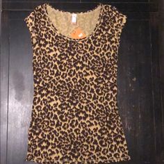 Leopard Print Fitted Tee W/ Scoop Neck. Ribbed. Longer Length. Comes From A Smoke Free Home. Fitted Leopard Print Short Sleeve T-shirt, Summer Crew Neck Leopard Print Tops, Leopard Print Crew Neck Top For Summer, Summer Leopard Print Crew Neck Tops, Leopard Print Cotton Tops For Spring, Casual Short Sleeve Leopard Print Top, Casual Leopard Print Tops For Summer, Casual Leopard Print Spring Tops, Stretch Leopard Print Tops For Summer