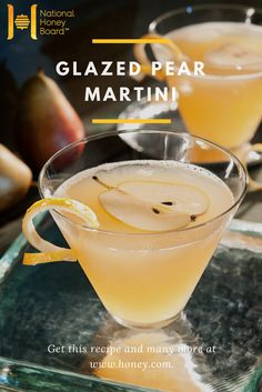 an apple cider is garnished with sliced apples and served in a glass bowl