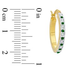 A bit of dazzle, a touch of fascination. Enjoy the sparkle! This sterling silver and 18K gold plated hoop earrings and bangle bracelet set adds smart style and shimmer to any look. Each piece features one diamond accent and one genuine emerald accent accompanying the beautiful gemstone enamel bead design in alternating emerald green and lustrous white. The 14.0mm hoop earrings secure with hinged backs, and the 7.0-inch bangle fits most wrists. Diamond Fascination™ is a patent handmade process which crystallizes diamond dust into enamel to simulate round-cut diamonds. Gold Hoop Jewelry With Channel Set, Gold Hoop Jewelry For May Birthstone, Yellow Gold Hoop Earrings With May Birthstone, Gold Hoop Earrings For Anniversary With May Birthstone, Gold Hoop Earrings For Anniversary, May Birthstone, Diamond Dust, Bangle Bracelet Set, Enamel Beads, Bangle Set