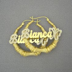 "*Personalized 10K/14K Yellow Gold Door Knocker Round Shape Bamboo Name Hoop Earring 1 3/8 Inch Diameter, these earrings comes in pair (right ear & left ear) and your names will be written in cursive letter font and butterfly end of name with diamond accent. *Up to 9 Characters. *Made with 100% 10K or 14K Yellow Gold, I don't offer any plated or gold filled jewelry at all. *Earring Diameter: 1 3/8 Inch / 3.4cm Approx. *Name Thickness: 0.55mm / 25 Gauges / 0.02\" Approx. *These name plates cu Custom Name Gold Earrings For Anniversary, Personalized Gold Nameplate Earrings, Personalized Nameplate Gold Earrings, Gold Earrings With Custom Name For Anniversary, Gold Nameplate Earrings Gift, Gold Nameplate Earrings For Gift, Gold Name Earrings For Anniversary, Personalized Gold-plated Earrings, Gold Earrings With Name For Anniversary