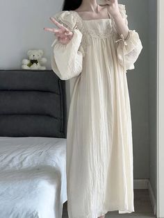 This elegant Coquette Lace Nightgown is crafted from a luxurious blend of fabrics for a comfortable and stylish fit. The all-over lace pattern is subtly sheer for a delicate and feminine look. Its adjustable straps, buttons, and drawstring waist make it the perfect nightgown for a perfect night’s sleep. Feminine Delicate Lace Nightgown For Loungewear, Spring Nightgown With Delicate Lace For Loungewear, Spring Delicate Lace Nightgown For Loungewear, Delicate Lace Nightgown For Spring Bedtime, Long Sleeve Lace Nightgown For Sleep, Lace Long Sleeve Nightgown, Spring Nightgown With Lace Patchwork For Loungewear, Spring Lace Patchwork Nightgown For Loungewear, Delicate Lace Sleepwear In Cream