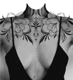 the back of a woman's neck with flowers and leaves tattooed on her chest