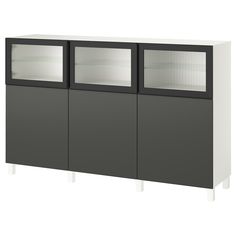 a white and black cabinet with glass doors