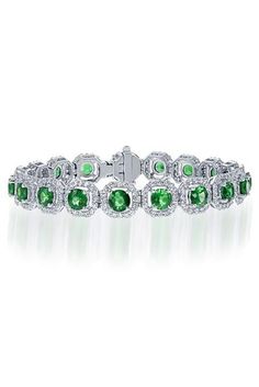 METAL SPECIFICATIONS Metal Name: White Gold 14K STONE SPECIFICATIONS Stone Name: EMERALD/DIAMOND Stone Cut : Round cut Stone Specifications: There are 18 green emeralds approx. 0.50 carats each and approx. 4.00 carats round smaller diamonds. Natural earth mined diamonds. Total Stone Weight : approx. 13.00 carats Color : G Clarity : SI1 Quality of Emeralds : AAA BRACELET SPECIFICATIONS Length : 7" Appraised Value : $34000.00 Comes with Certificate Green Emerald, Emerald Diamond, Stone Names, Emerald Green, Round Cut