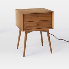 a small wooden table with two drawers on one side and an electric cord in the other