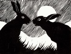 two black rabbits facing each other in front of a white and black background with the letter q on it