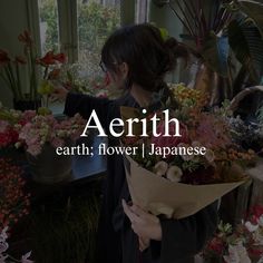 a woman holding a bouquet of flowers with the words aerthh in front of her