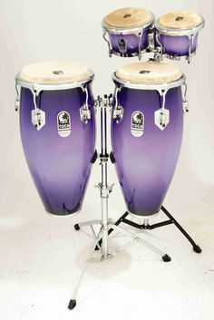 a set of purple drums on a white background