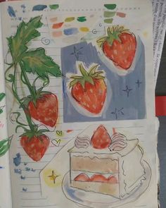 an open notebook with drawings of strawberries and cake