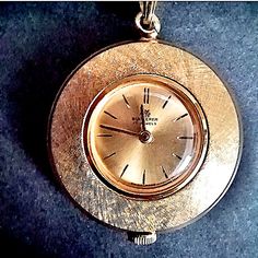 Vintage Bucherer Gold Plated Ladies Pendant Stem Wind Watch. Round Face With Gold Tone Florentine Finish. This Watch Is In Perfect Working Condition And Keeps Perfect Time. 30" Chain Pendant Watch, Pendant Watches, Round Face, Accessories Watches, Gold Tones, Gold Plate, Plating, Women Accessories, Chain