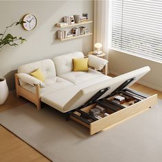 a white couch sitting on top of a living room floor next to a wooden table