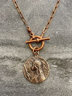 St. Joan of Arc Necklace Solid bronze chain and medal Antique Finish Copper Medallion Jewelry, Bronze Coin Pendant Medallion Necklace, Bronze Metal Necklace With Coin Pendant, Bronze Copper Medallion Jewelry, Bronze Medallion Necklace With Coin Pendant, Bronze Medallion Necklace With Adjustable Chain, Antique Copper Medallion Necklace, Bronze Metal Medallion Necklace, Nickel-free Copper Medallion Necklace