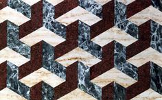 an abstract marble pattern with red and white stripes on it's sides, as well as the diagonals