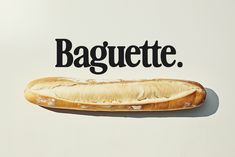 a long hot dog on a bun with the word baguette written above it