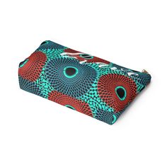 These t-bottom pouches now come in our retro color burst Ankara pattern print, and are great for pretty much anything. They make an fabulous, stylish grab and go bag; pencil case and cosmetic travel bag. Constructed of a durable material with a zipper closure. .: 100% Polyester .: Multiple sizes .: T-bottom 2.5 inches long .: With non-laminated lining Large Width, in 2.88 Length, in 12.29 Height, in 6.93 Trendy Multicolor Pencil Case With Zipper, Trendy Multicolor Cosmetic Bag, Travel Pencil Case Multicolor Rectangular, Trendy Multicolor Pouch For Personal Use, Trendy Multicolor Portable Cosmetic Bag, Multicolor Rectangular Cosmetic Bag For Travel, Multicolor Rectangular Travel Cosmetic Bag, Multicolor Rectangular Pouch With Pen Holders, Artistic Rectangular Pouch For Everyday Use