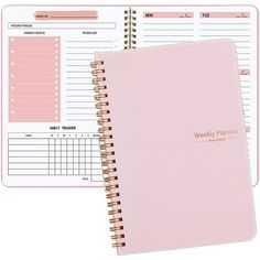 a pink planner with the words weekly planner on it and a spiral bound notebook next to it