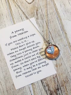 a necklace with a poem written on it