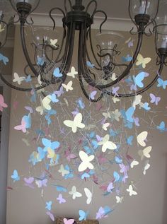 a chandelier with butterflies hanging from it