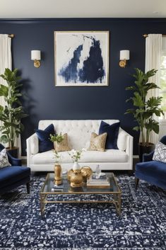 a living room with blue walls and white couches, gold accents on the coffee table