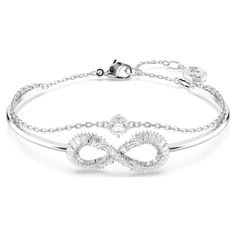 Infused with delicate beauty and symbolism, this Hyperbola bangle can be worn time and time again. The rhodium-plated design features a rigid band with an infinity motif, which is adorned with clear Swarovski Zirconia. A second chain has also been added, with a single round Swarovski Zirconia set at the center. A stunning double-wrapped bangle that will effortlessly carry you from day to night. Finnish Jewelry, The Bangles, White Crystals, Pierced Jewelry, Swarovski Jewelry, Single Earring, Adjustable Bracelet, Crystal Pendant, Metal Jewelry