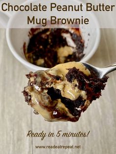 chocolate peanut butter mug brownie is in a white bowl with a spoon full of pudding