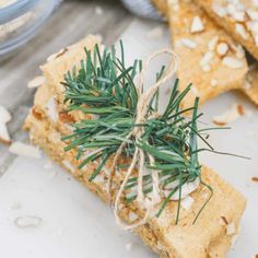 crackers with rosemary sprigs tied to them