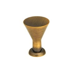 an antique brass finish knob on a white background