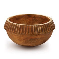 a wooden bowl sitting on top of a white surface