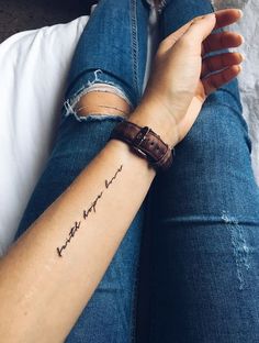 a woman's arm with a tattoo that reads, i love you to the moon and back