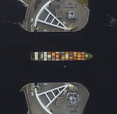 an aerial view of two ships in the water