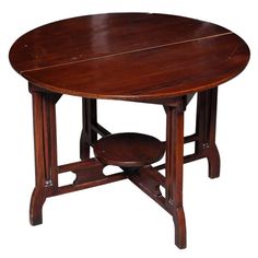 an oval wooden table with one section missing from the top and two sections missing from the bottom