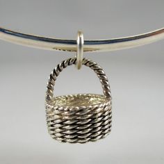 "This three-dimensional, antiqued sterling silver Nantucket (east coast) style Easter Basket charm features a tightly woven cane texture and a stationary handle. Vintage and in brand new, never worn condition. Made by Brown County Silver. 3/8\" diameter 1/2\" high 2.7 grams approx. See more @ https://www.etsy.com/shop/brocosi" Antique Sterling Silver Bracelet Nickel-free Gift, Antique Silver Sterling Bracelet Nickel-free, Nickel-free Antique Silver Sterling Bracelet As A Gift, Nickel-free Antique Silver Sterling Silver Bracelet For Gift, Nickel-free Antique Silver Sterling Silver Bracelet, Antique Silver Sterling Bracelet For Gifts, Antique Silver Bracelet Gift, Antique Silver Sterling Bracelet As Gift, Antique Silver Round Sterling Silver Bracelet For Gift