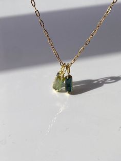 "Charm Duo Exclusive!" Mix-n-Match, buy any 2-charms and get 1O% off , use promo-code ↠ LOVE1O  Limited-time offer! Dive into a new magical world with our Green Tourmaline Charm--a rare gem of nature. All gem are one-of-a-kind and handmade to perfection!  Choose yours now for a touch of rare beauty --A timeless addition to your collection or the perfect gift✨ [Hit the 'Like' button 💗 & stay updated for special offers!] ---- ✪Gemstone: Natural Blue & Green Tourmalines, semi-raw faceted. Experien