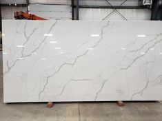 a large white marble slab in a warehouse