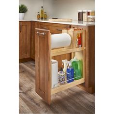 an open cabinet in the middle of a kitchen with cleaning products and other items inside