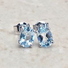 Beautiful 14 karat white gold studs earrings featuring two natural 7x5 mm oval aquamarines the birthstone for March! The gemstones weigh approximately 1.55 carat. Closure: Push Backs Weighs 0.86 gram. Birthstone: March. Condition: Brand New. - 14 day return policy, no questions asked. - Free insured shipping in the US. - International shipping available. Visit our website for more details about our company: www.weiljewelry.com Oval Gemstone Earrings For Anniversary, Oval Birthstone Earrings In White Gold, Oval White Gold Earrings With Birthstone, Gold Studs Earrings, Smoky Quartz Jewelry, Aquamarine Studs, White Gold Pendant Necklace, White Gold Earrings Studs, White Gold Studs