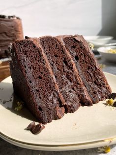 three slices of chocolate cake on a plate