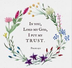 a wreath with flowers and the words in you, lord my god, i put my trust