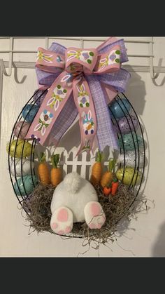 an easter wreath with bunny ears and carrots