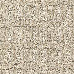 a beige carpet with small squares on it