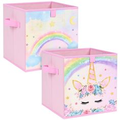 two pink storage boxes with unicorn faces and rainbows painted on the sides, one is closed