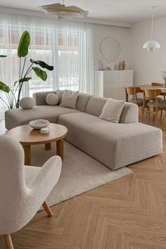 a living room filled with furniture and a large window