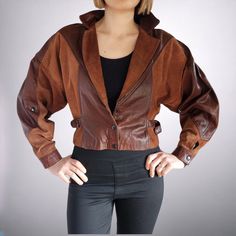 Embrace nostalgic 90s style with this stunning vintage crop jacket! Crafted with a mix of luxe suede and leather materials in a rich brown hue, this jacket exudes timeless elegance. The oversized silhouette in a Size 12 offers a comfy and on-trend look, perfect for the winter season. Channel your inner fashionista with this Women's Winter Classic piece that will elevate any outfit with its vintage charm. DRY CLEANED since acquired by HRV and treated with RM Williams leather conditioner. Size 10 Luxury Vintage Distressed Brown Leather Jacket, Brown Leather Jacket With Suede Overlays, Brown Leather Long Sleeve Cropped Jacket, Brown Leather Cropped Jacket With Long Sleeves, Vintage Brown Suede Leather Jacket, Chic Brown Leather Cropped Jacket, Suede Leather Jacket, Size 12 Women, Size 10 Women