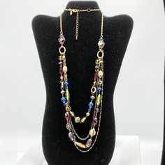 Brass tone with multicolored glass beads necklace by Lia Sophia. Long Glass Beaded Chain Necklace, Multicolor Long Glass Necklace, Multi-strand Glass Bead Colorful Necklace, Multi-strand Glass Beaded Colorful Necklace, Colorful Multi-strand Glass Bead Necklaces, Multi-strand Glass Necklace With Colorful Beads, Glass Multi-strand Necklace With Colorful Beads, Multicolor Glass Beaded Necklaces, Multi-strand Glass Necklaces For Party