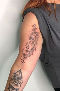 a woman's arm with a tattoo on it and a rose in the middle